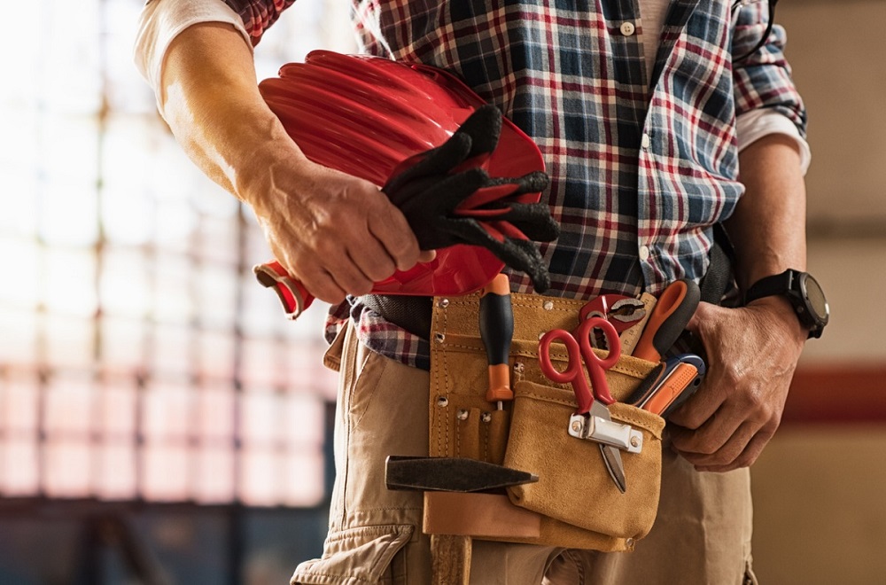 bricklayer-holding-construction-tools-Handyman Handyman